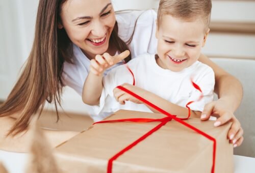 Happy family packing a Christmas gift