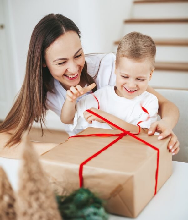 Happy family packing a Christmas gift