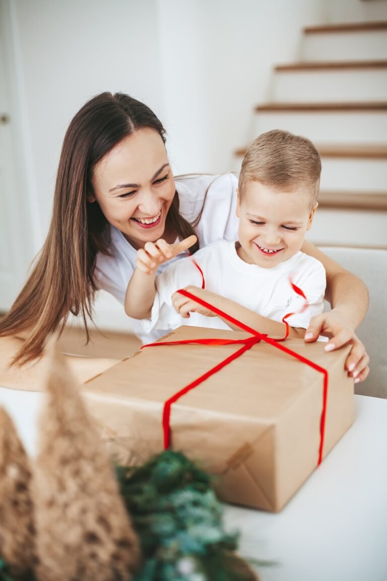 Happy family packing a Christmas gift