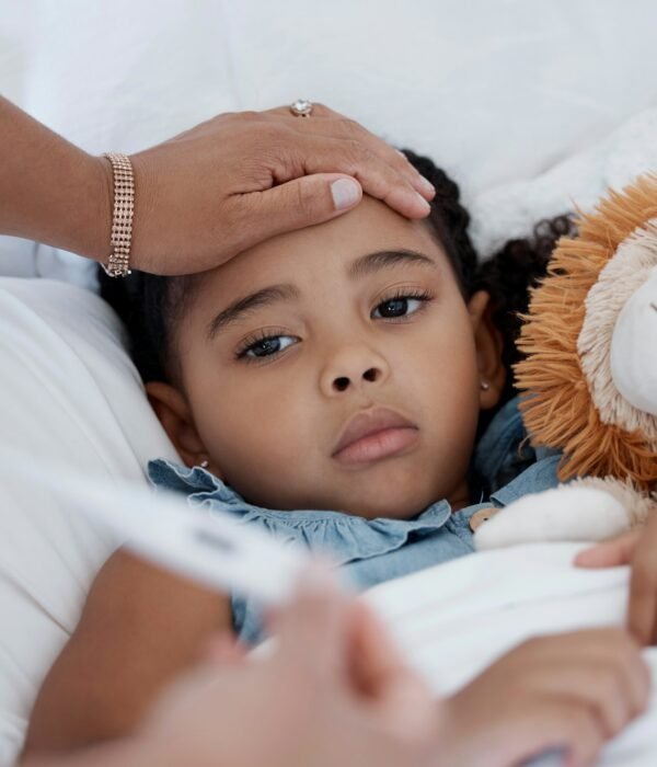 Sick child, covid and medical emergency in bed of home, healthcare problem in bedroom of house and