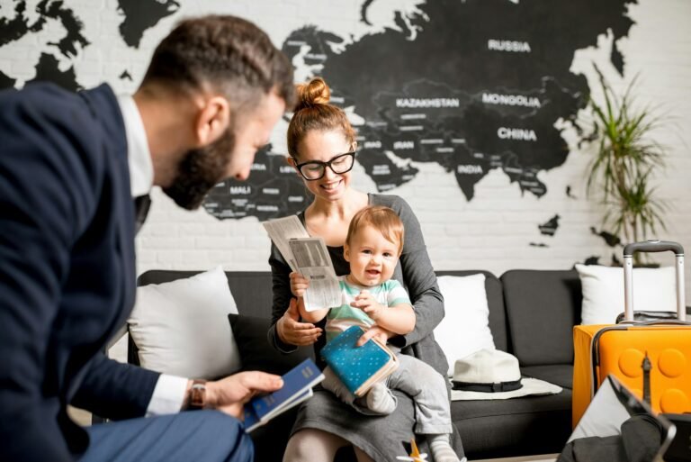 Woman and baby boy with travel agent at the office